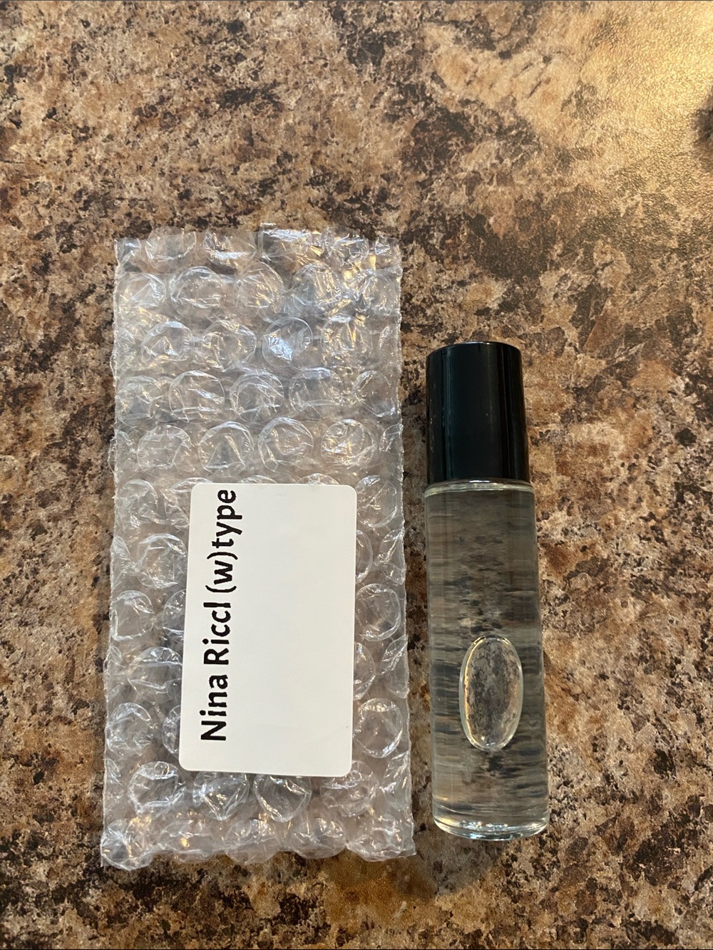 Nina Ricci Type Rollerball Perfume Sample - Clear with Black Cap